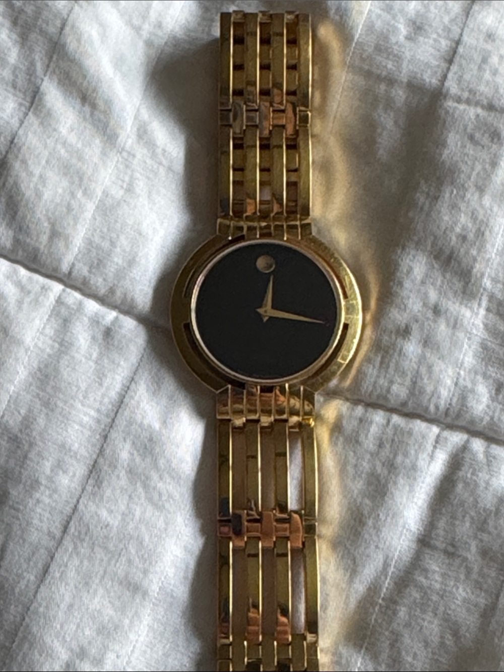 Gold Men's Movado Watch with Black face
